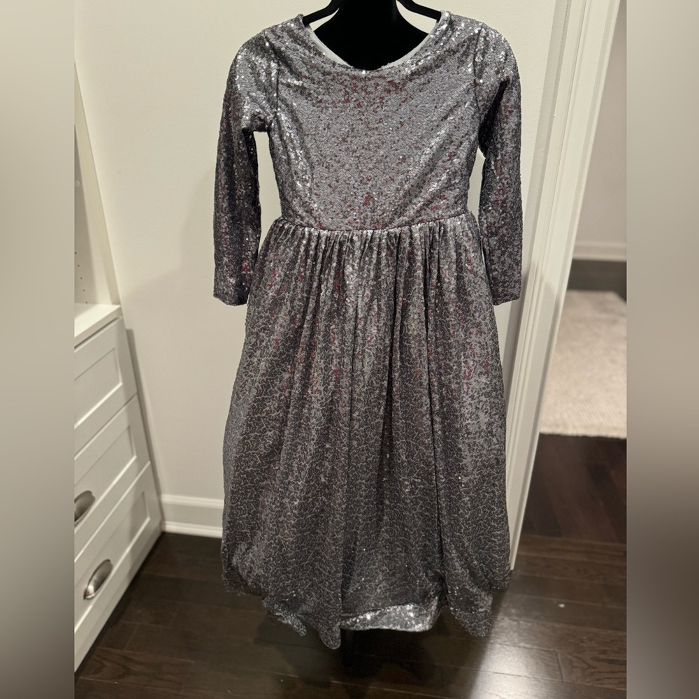 Never worn! Gorgeous silver sequin gown! Comes in sizes 8/10 and 10/12